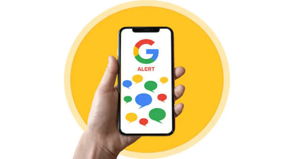 A hand holding a phone with Google's logo on it